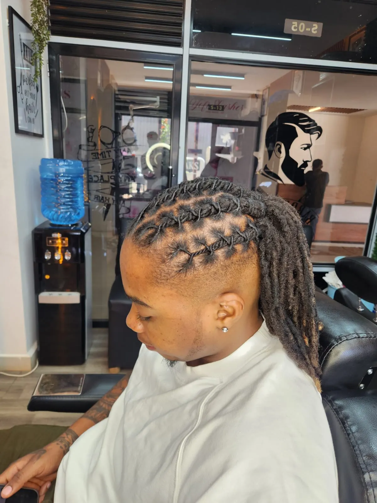 Finished loc retouch with a clean fade at Beauty by Haks