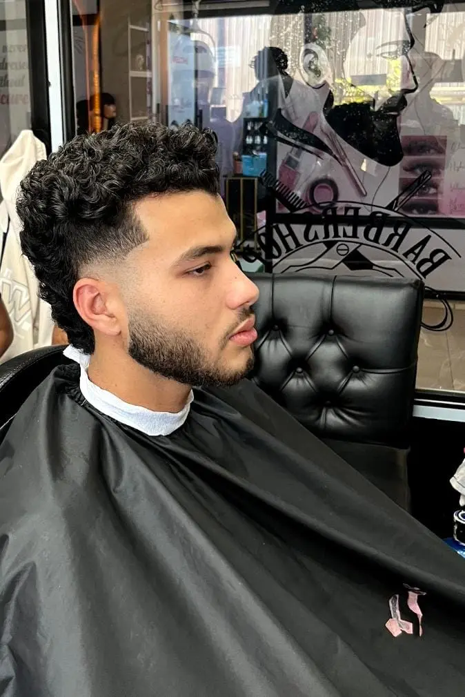 Men's curly hair with a fade cut